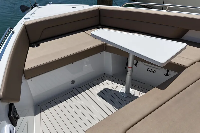 Slide: The Image of Luxurious seating area on 2026 Cruisers Yachts 38 VTR with sleek table design. - 24
