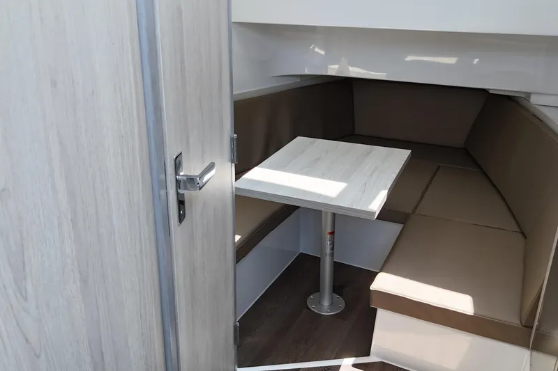 Slide: The Image of 2026 Cruisers Yachts 38 VTR interior with cozy seating and table. - 25