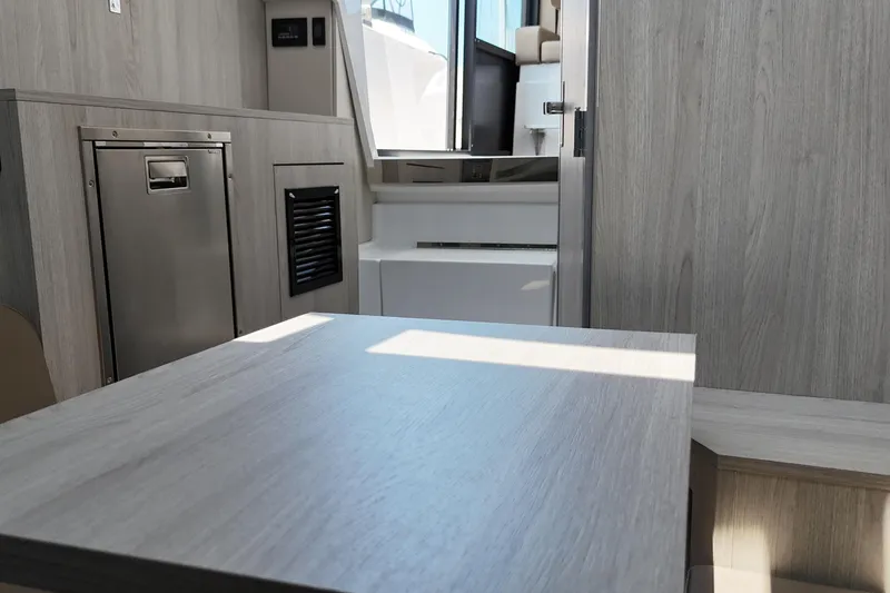 Slide: The Image of Interior of 2026 Cruisers Yachts 38 VTR, featuring modern wood finishes and compact design. - 27