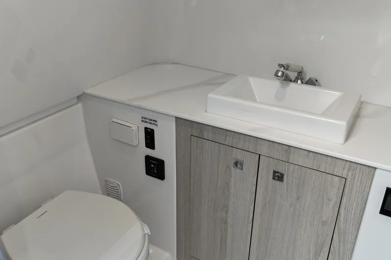 Slide: The Image of Modern bathroom in 2026 Cruisers Yachts 38 VTR, featuring sleek sink and cabinetry. - 28