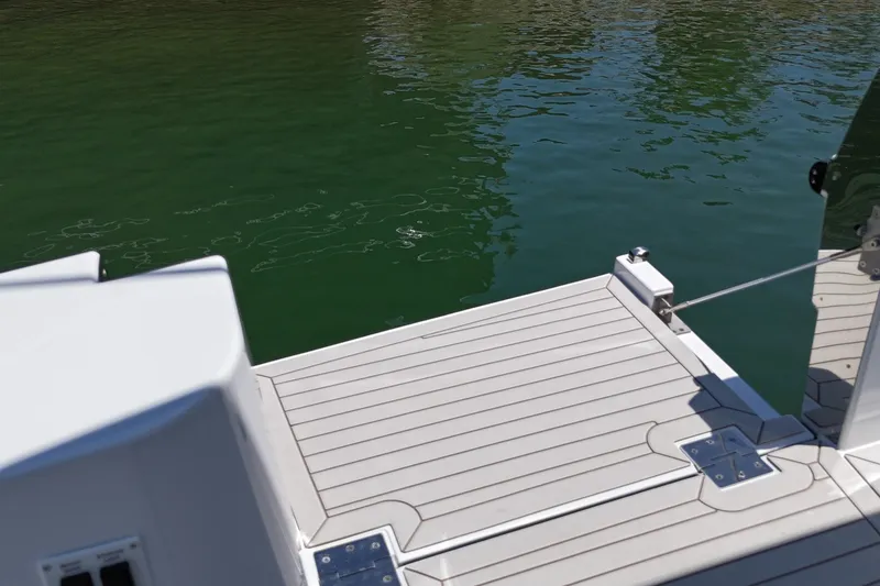 Slide: The Image of Sleek deck of 2026 Cruisers Yachts 38 VTR on calm water. - 29