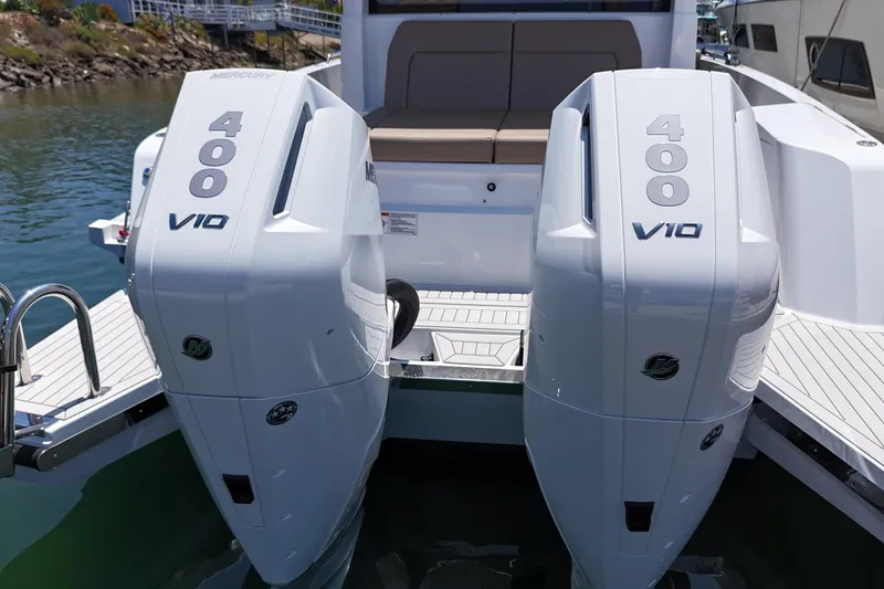 Slide: The Image of 2026 Cruisers Yachts 38 VTR with dual Mercury 400 V10 engines, docked by the water. - 31