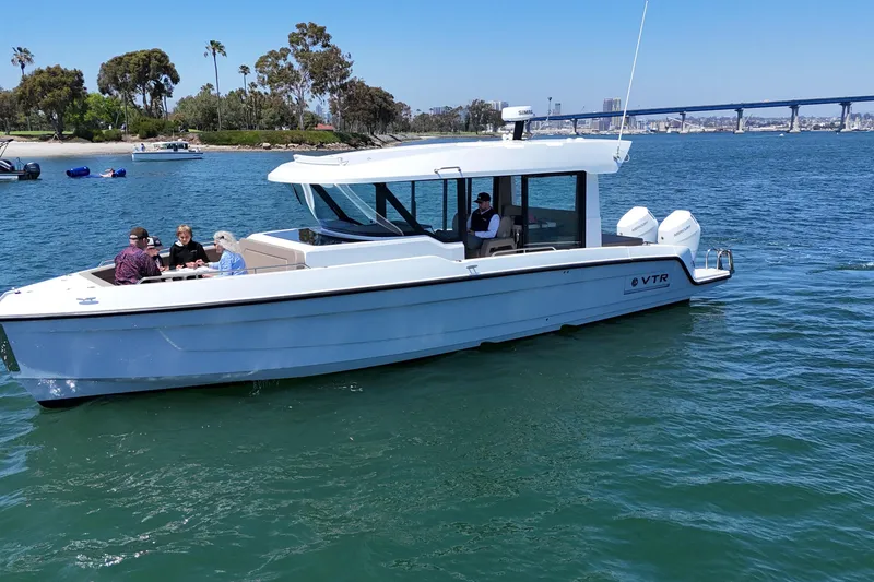 Slide: The Image of 2026 Cruisers Yachts 38 VTR on water, people enjoying a sunny day. - 8