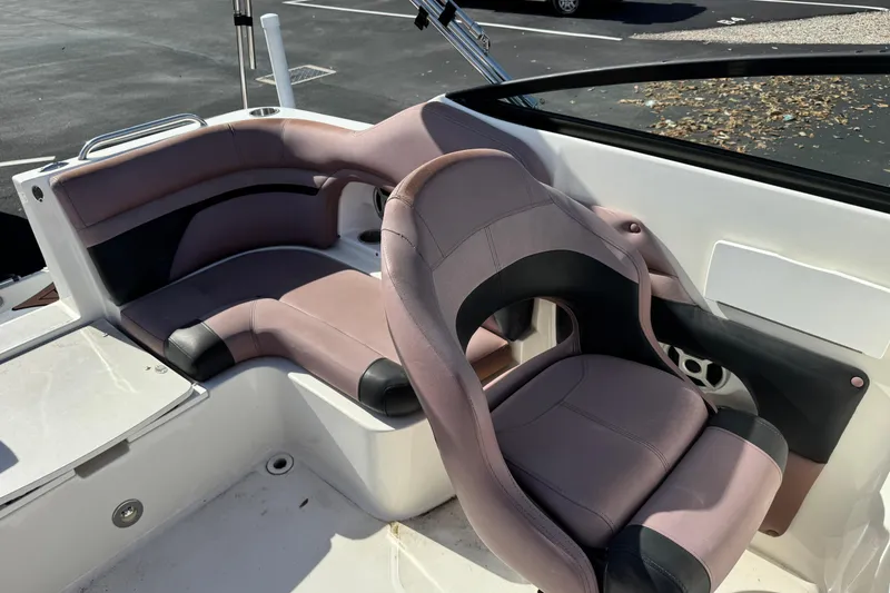 Slide: The Image of 2018 Hurricane SunDeck 2400 OB boat interior with plush seating and modern design. - 15