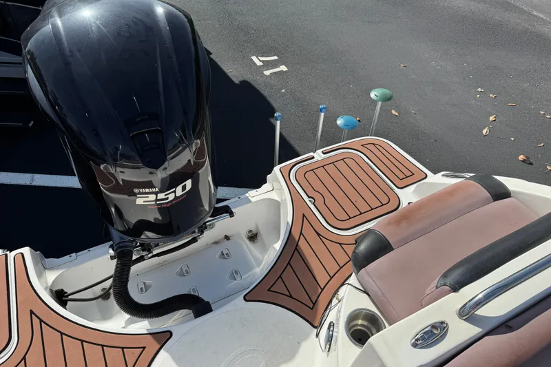 Slide: The Image of 2018 Hurricane SunDeck 2400 OB with Yamaha 250 outboard motor, featuring teak-style decking. - 21