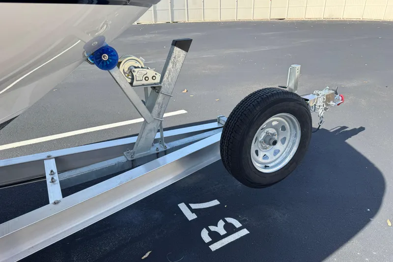 Slide: The Image of Trailer for 2018 Hurricane SunDeck 2400 OB boat in parking space B7. - 24