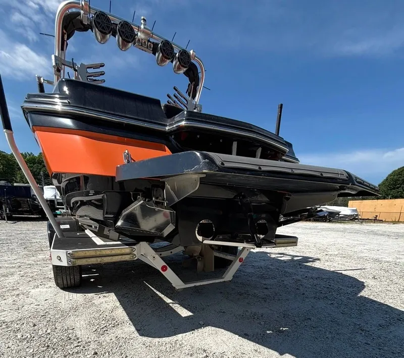 Slide: The Image of 2013 MasterCraft XStar boat on trailer, rear view. - 14