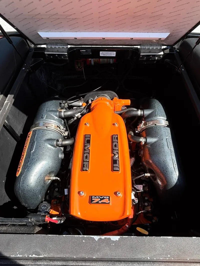 Slide: The Image of 2013 MasterCraft XStar Ilmor engine in bright orange. - 15