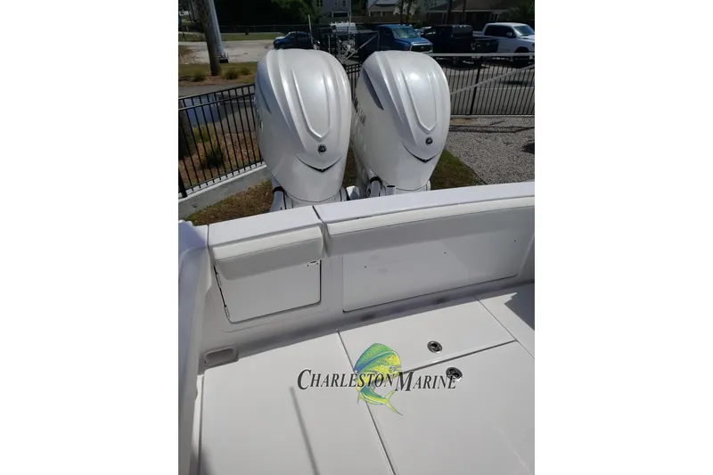 Slide: The Image of 2026 Jupiter 30 boat with dual outboard engines at Charleston Marine. - 14