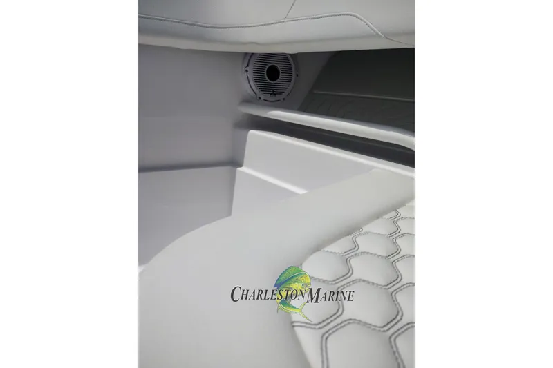Slide: The Image of Interior of 2026 Jupiter 30 boat with white seating and speaker detail. - 15