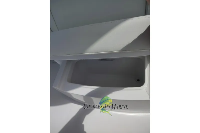 Slide: The Image of Open storage compartment on a 2026 Jupiter 30 boat, featuring sleek white interior design. - 16