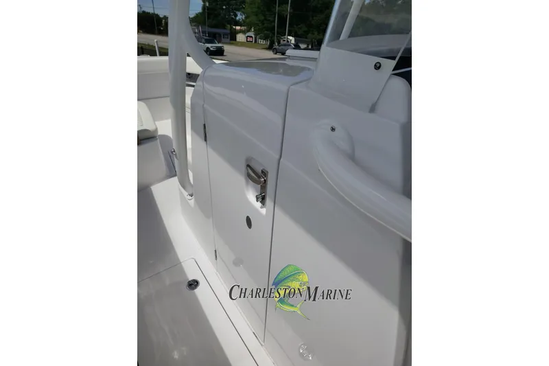 Slide: The Image of 2026 Jupiter 30 boat interior with sleek white finish and Charleston Marine logo. - 17