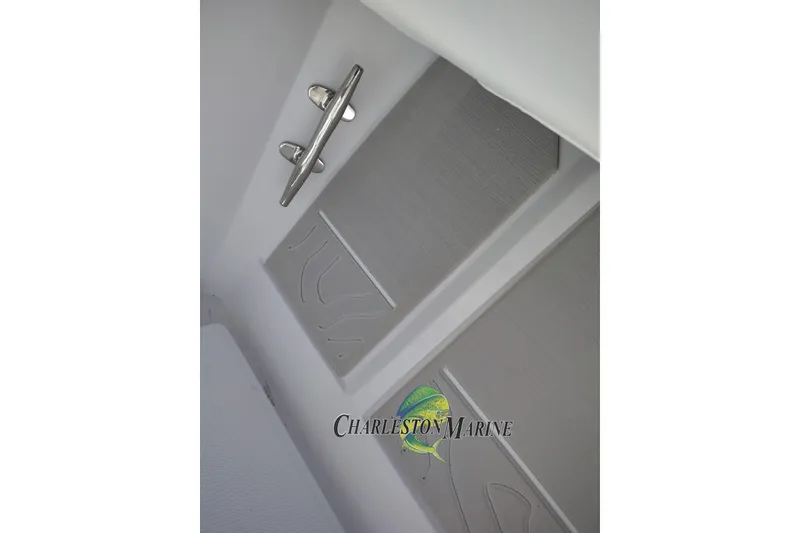 Slide: The Image of Interior detail of 2026 Jupiter 30 boat with sleek metal handle and textured paneling. - 18