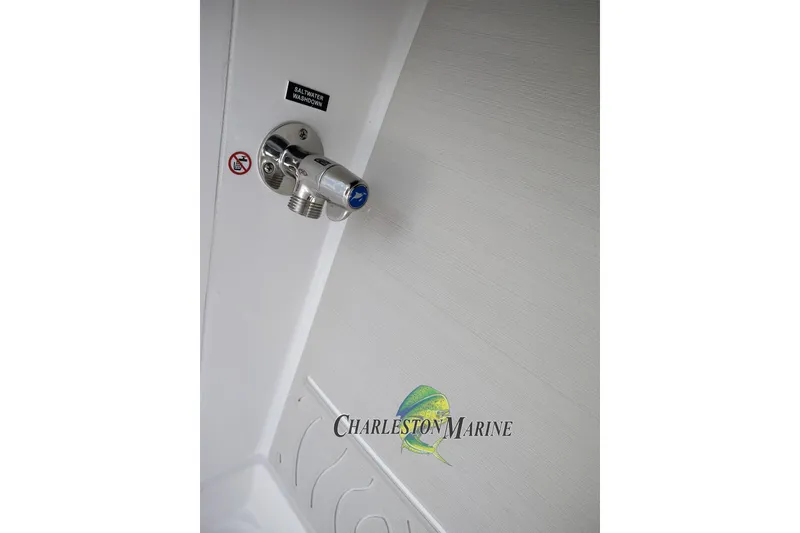 Slide: The Image of 2026 Jupiter 30 boat saltwater washdown faucet, Charleston Marine branding. - 19