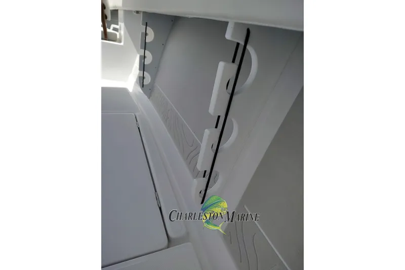 Slide: The Image of Interior view of a 2026 Jupiter 30 boat, featuring storage compartments. - 20