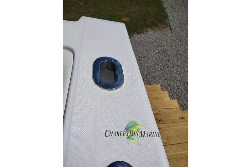 Slide: The Image of 2026 Jupiter 30 boat deck with Charleston Marine logo and metal fitting. - 21