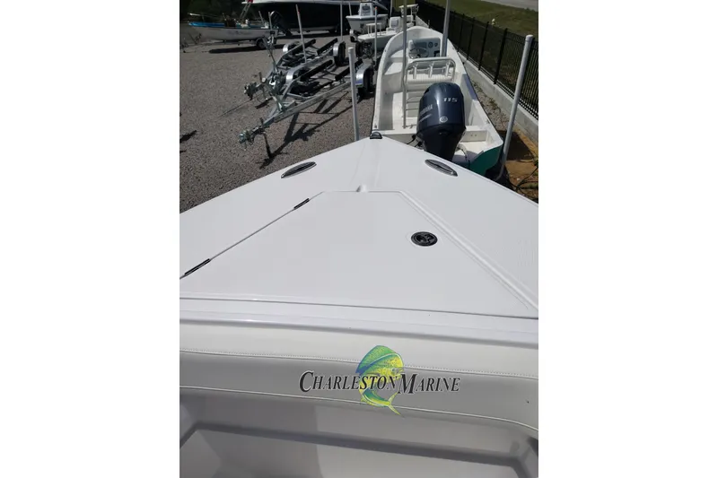 Slide: The Image of 2026 Jupiter 30 boat at Charleston Marine, featuring sleek design and powerful engine. - 22