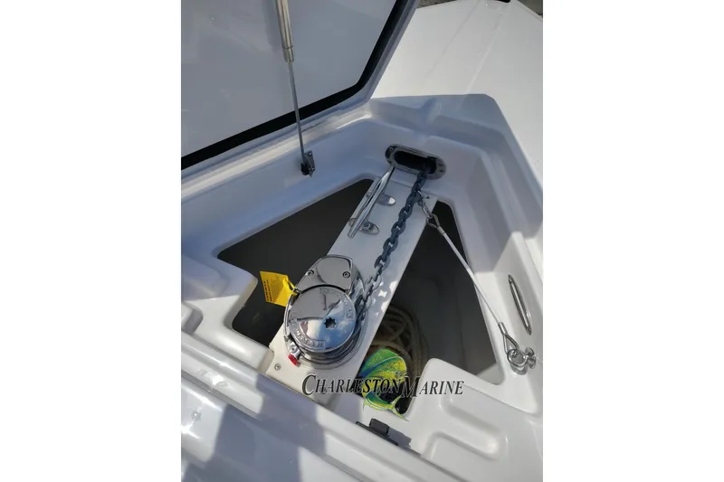 Slide: The Image of Anchor chain compartment on a 2026 Jupiter 30 boat, featuring a secure storage area. - 23