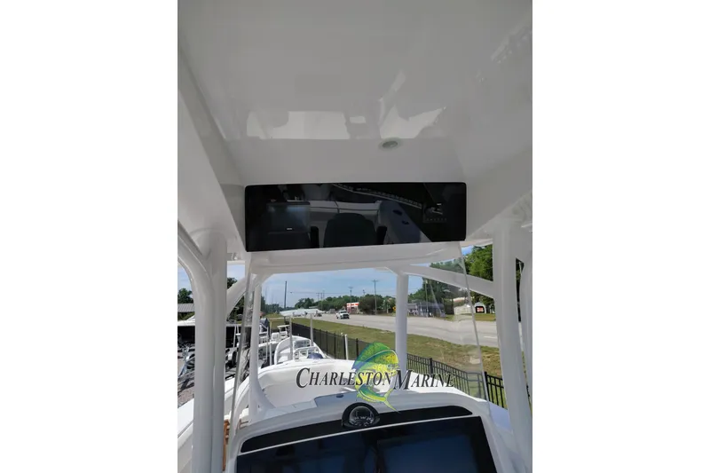 Slide: The Image of 2026 Jupiter 30 boat interior with Charleston Marine logo, featuring sleek design elements. - 25