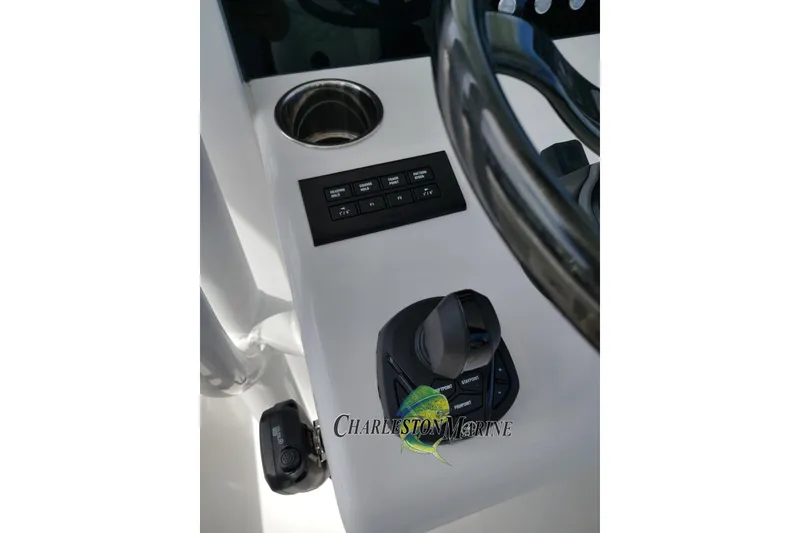 Slide: The Image of Control panel of 2026 Jupiter 30 boat with steering wheel and joystick. - 26