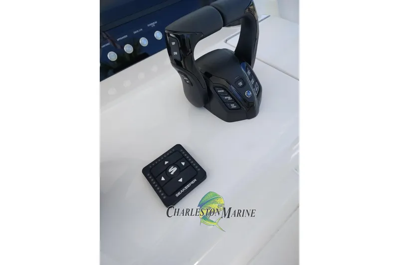 Slide: The Image of Boat control panel with throttle and Seakeeper control on a 2026 Jupiter 30. - 27