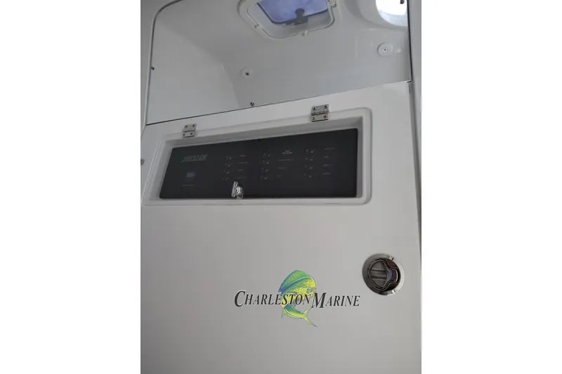 Slide: The Image of Control panel of a 2026 Jupiter 30 boat, featuring Charleston Marine logo. - 29
