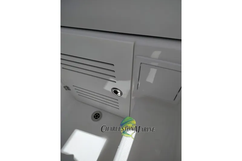 Slide: The Image of Interior detail of a 2026 Jupiter 30 boat, featuring a sleek compartment design. - 33