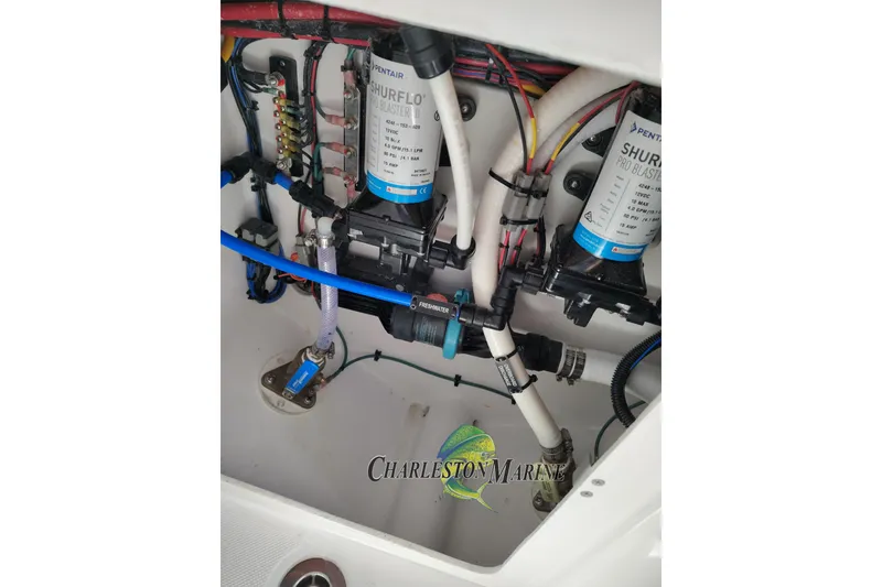 Slide: The Image of Boat plumbing system with Shurflo pumps in a 2026 Jupiter 30 model. - 34