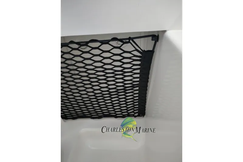 Slide: The Image of Storage net in a 2026 Jupiter 30 boat, featuring Charleston Marine branding. - 35