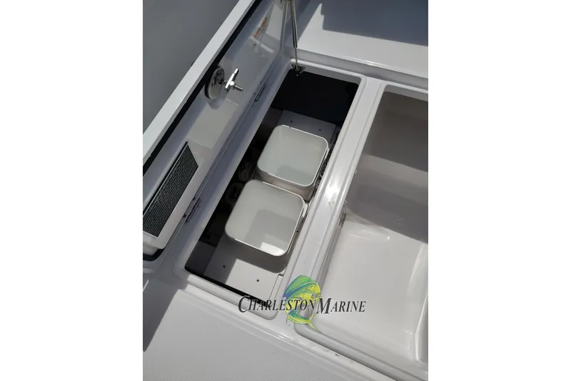 Slide: The Image of Open storage compartments on a 2026 Jupiter 30 boat deck. - 38