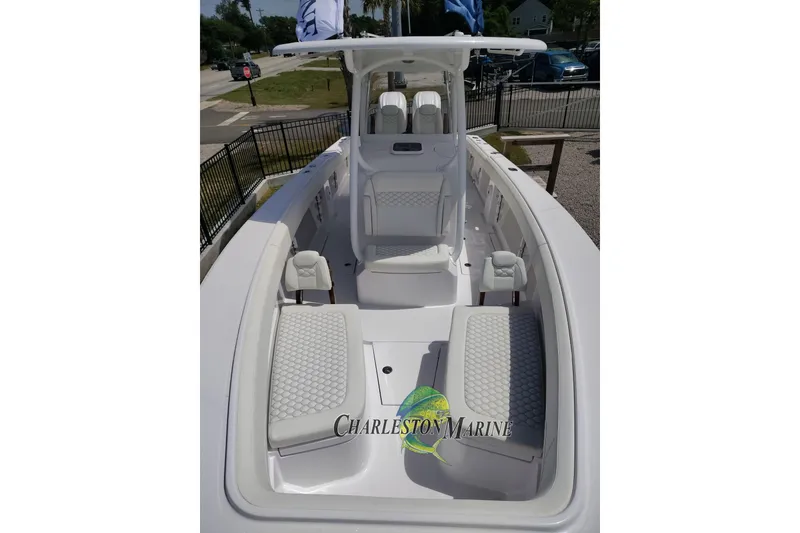 Slide: The Image of 2026 Jupiter 30 boat interior with white seating, Charleston Marine logo visible. - 5