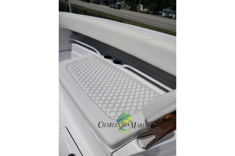 Slide: The Image of Luxurious seating on 2026 Jupiter 30 boat with hexagonal pattern upholstery. - 6