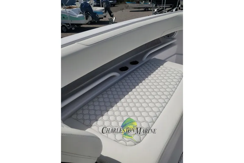 Slide: The Image of Luxurious seating on a 2026 Jupiter 30 boat, featuring elegant hexagonal stitching. - 7