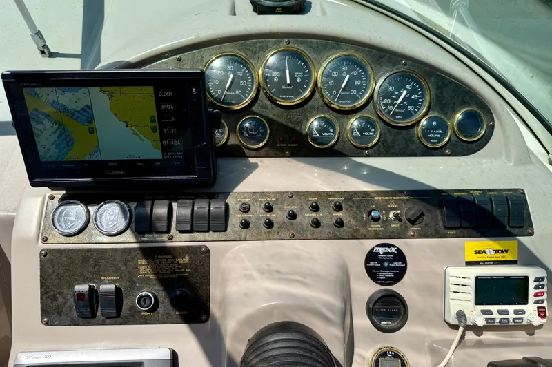 Slide: The Image of Dashboard of a 2002 Cruisers Yachts 2870 Express with navigation and control instruments. - 11