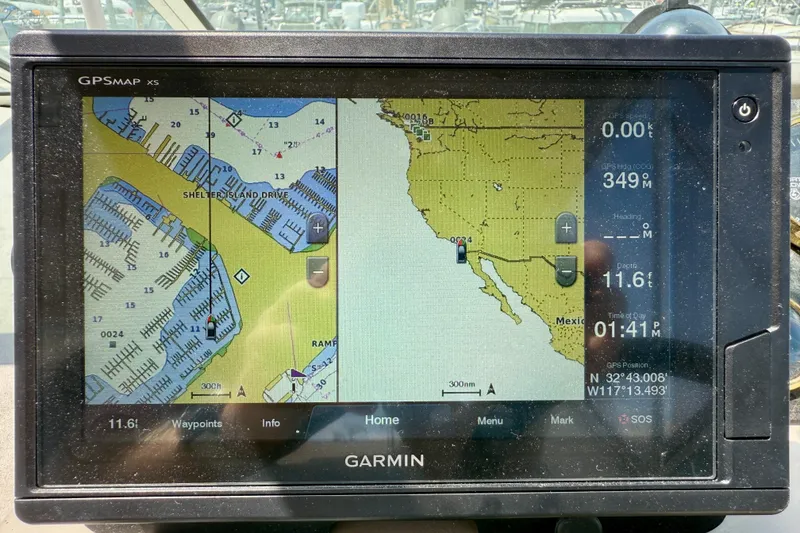 Slide: The Image of Garmin GPS display on 2002 Cruisers Yachts 2870 Express, showing nautical map and coordinates. - 12