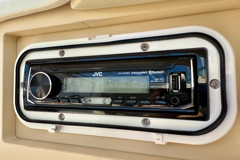 Slide: The Image of JVC stereo system on 2002 Cruisers Yachts 2870 Express, featuring Bluetooth and USB connectivity. - 28
