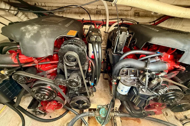 Slide: The Image of Engine compartment of a 2002 Cruisers Yachts 2870 Express, showcasing dual Volvo Penta engines. - 29