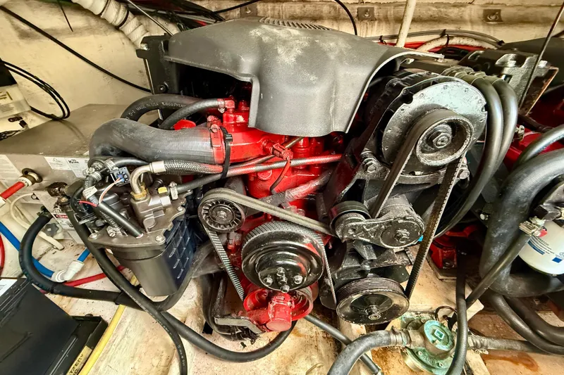 Slide: The Image of Engine compartment of a 2002 Cruisers Yachts 2870 Express, showcasing mechanical components. - 30