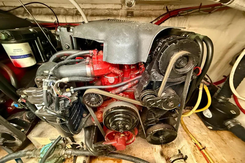 Slide: The Image of Engine compartment of a 2002 Cruisers Yachts 2870 Express, showcasing mechanical components. - 31