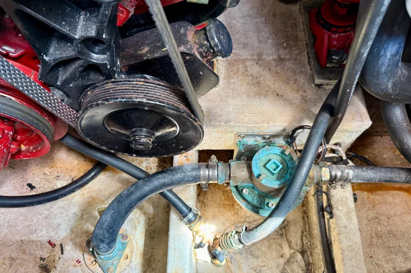 Slide: The Image of Engine compartment of 2002 Cruisers Yachts 2870 Express with visible belts and hoses. - 32