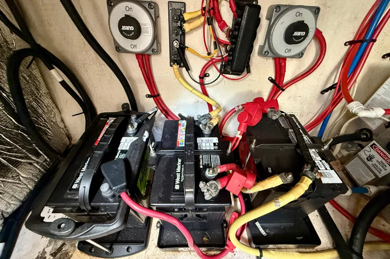 Slide: The Image of Battery compartment of a 2002 Cruisers Yachts 2870 Express with wiring and switches. - 34