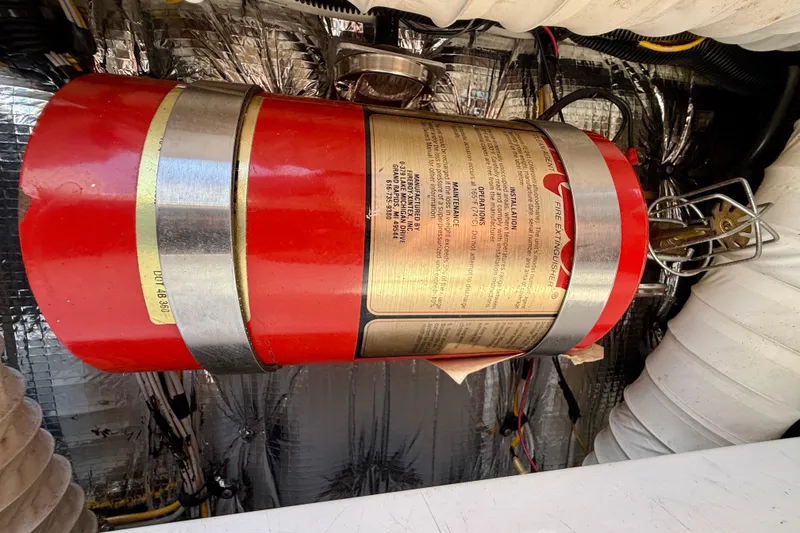 Slide: The Image of Red fire extinguisher in 2002 Cruisers Yachts 2870 Express engine compartment. - 37