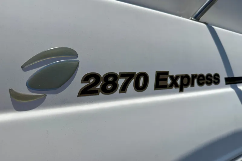 Slide: The Image of 2002 Cruisers Yachts 2870 Express logo on white boat exterior. - 5