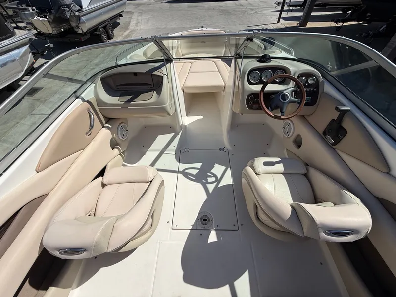 Slide: The Image of Interior of a 2006 Chaparral SSi 210 boat with beige seats. - 10