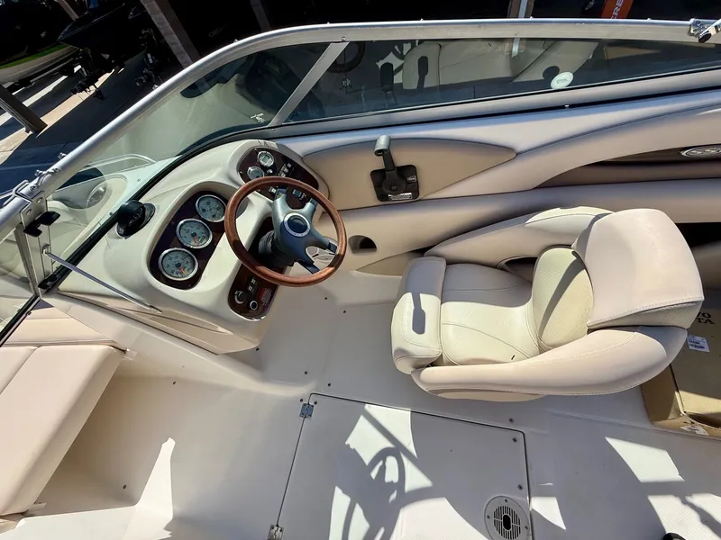 Slide: The Image of Interior of a 2006 Chaparral SSi 210 boat with steering console. - 11