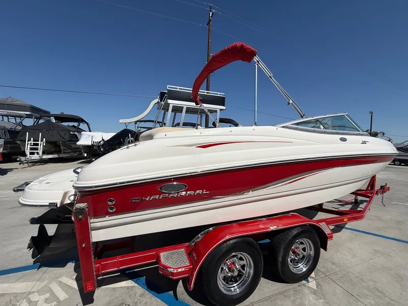 Slide: The Image of 2006 Chaparral SSi 210 boat on red trailer outdoors. - 6