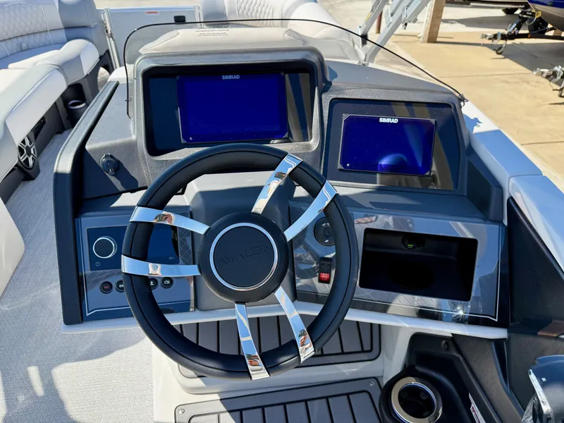 Slide: The Image of Avalon Excalibur LTD Flex Lounge 2026 helm with Simrad displays. - 19