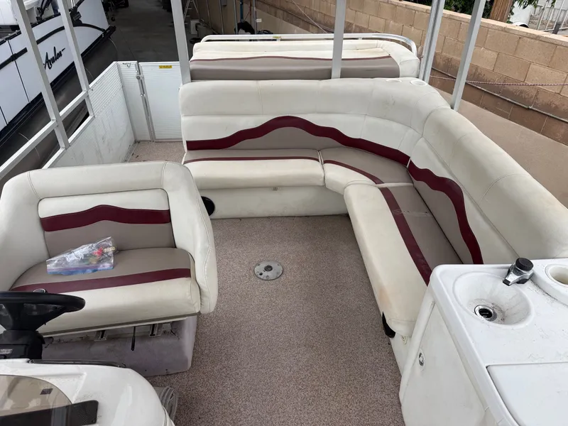 Slide: The Image of Interior of a 2003 Sea Ray Sundancer 280 with white and red seating. - 4