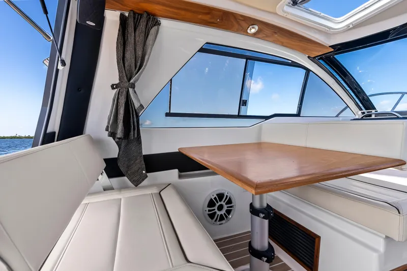 Slide: The Image of Interior of 2026 Solara S-250 Coupe with elegant seating and wooden table. - 11