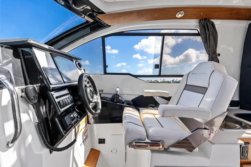 Slide: The Image of Interior of 2026 Solara S-250 Coupe with modern dashboard and luxurious seating. - 13